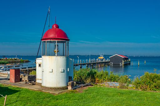 A beautiful seascape view with a small lighthouse at Marken, the Netherlands