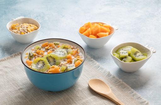 Healthy fruit breakfast - muesli with kiwi and mango