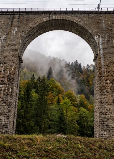 Spectacular view of the old railway bridge at the Ravenna gorge viaduct in Breitnau with some mist in the background, Germany