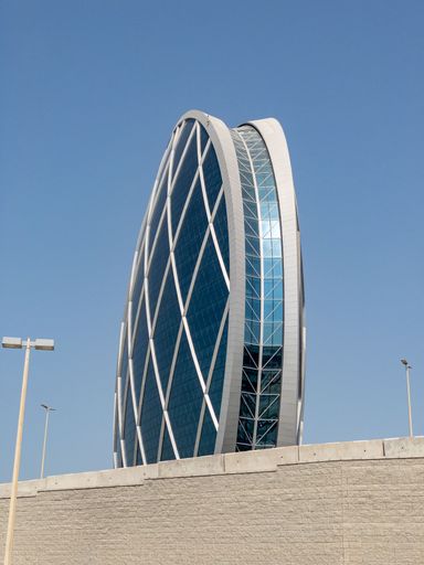 Aldar Head Quarters Building in Abu Dhabi the shape of a disk with a height of around 80 meters