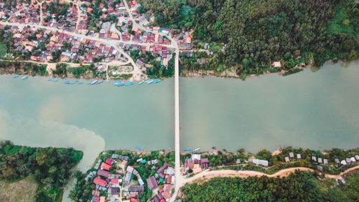 An aerial top view of the city by the lake