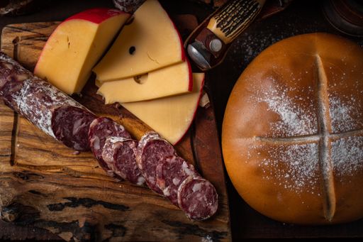 A top view of cheese sausage and a bread