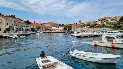 A beautiful view of small fishing harbor in Cavtat during the daytime