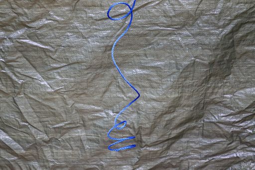 A closeup shot of hanging blue rope
