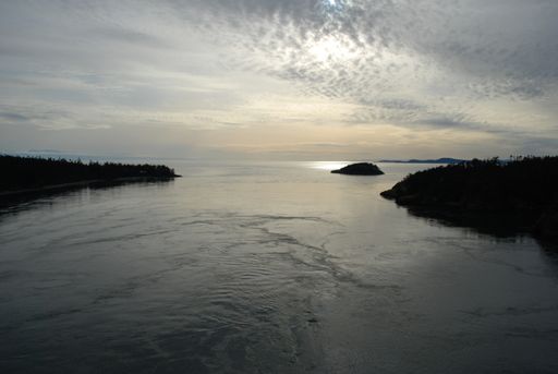 A breathtaking view of a lake under the beautiful cloudy sky