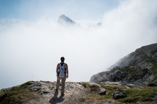 unrecognizable woman looking at a mountain in Picos de Europa, Spain