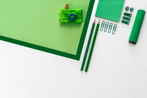 A top view of the office working various tools on the white surface