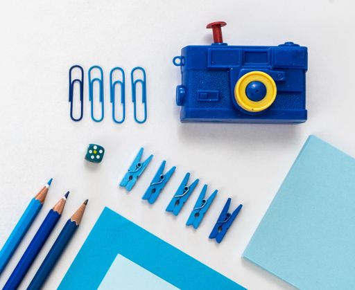 A top view of the office working various tools on the white surface