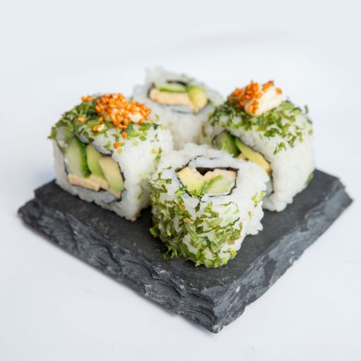 A close-up shot of veggie sushi rolls on a rocky board isolated on a white background