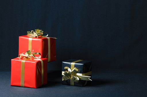 A closeup shot of Christmas gift boxes isolated on a dark background