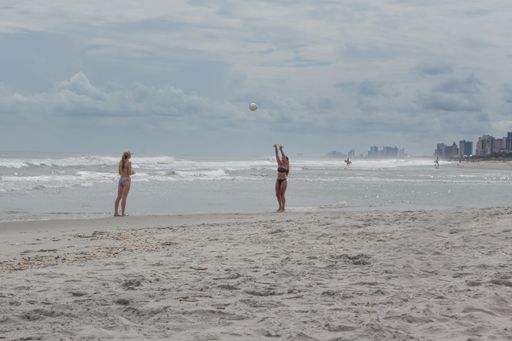 Image of two women playing volley ball on Myrtle Beach in South Carolina as photographed in August of 2020.