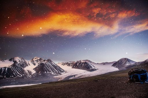 Night sky and stars at Altai Tavan Bogd mountains in western part of Mongolia. Peaks of Malchin, Khuiten, Naran, Nairamdal and Burged.