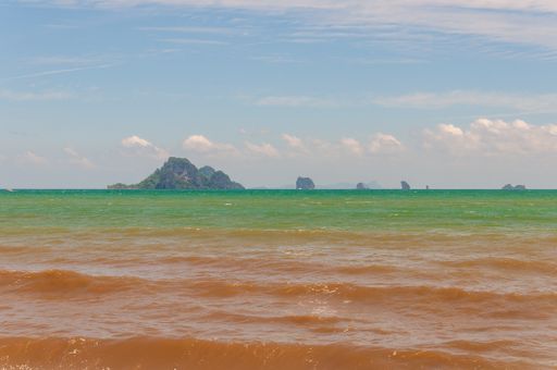 The ocean with calm waves moving towards the shore in Ao Nang Krabi, Thailand, Asia
