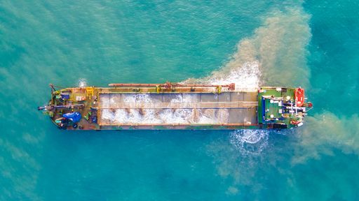 An aerial view of an industrial ship sailing in the sea