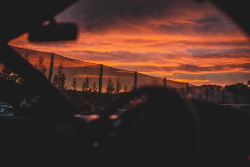 A beautiful scenery of the sunset sky taken through a car window in New Zealand