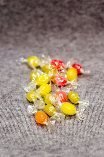 A vertical shot of colorful hard-boiled wrapped candy pile