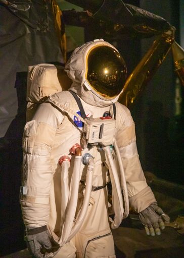 A vertical shot of the replica of Apollo 11 with Buzz Aldrin in Science Museum London