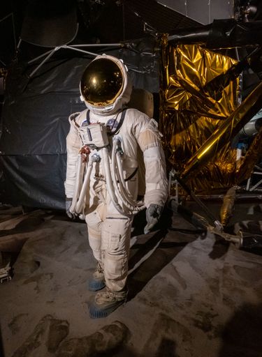 A vertical shot of the replica of Apollo 11 with Buzz Aldrin in Science Museum London