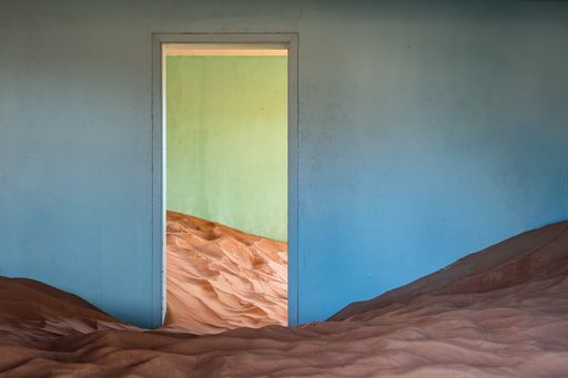 Photo of an abandoned house within an abandoned village