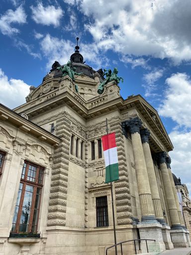 A low angle of the architectural building of Szechenyi Thermal Bath in Budapest against the blue sky