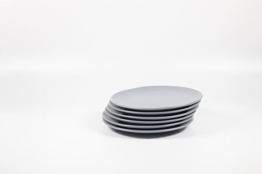 A closeup shot of white plates  on white background