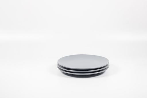 A closeup shot of white plates  on white background
