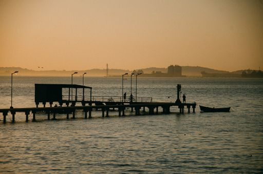 A view of the silhouette of the bridge on the sea during sunset in Guanabara Bay in Rio de Janeiro