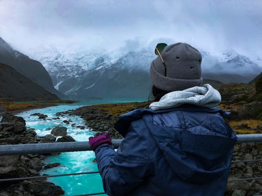A back view of a female hiker enjoying beautiful nature scenes