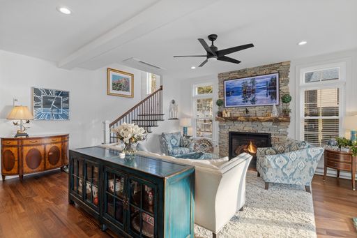 A beautiful light living room with a fireplace and white walls