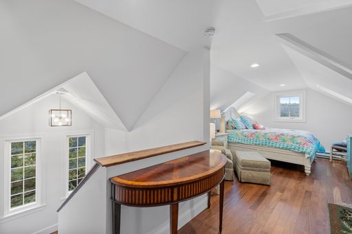 A beautiful modern bedroom with a comfortable bed against the white walls