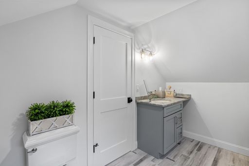 A beautiful light interior with a sink near a white wooden door