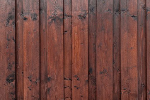 A brown wooden fence made of oak - perfect for a cool background