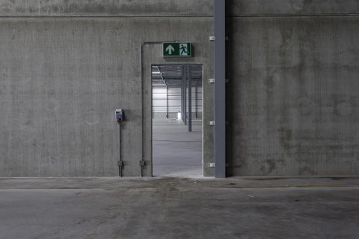 The inside of a distribution center - looking through a door to another unit