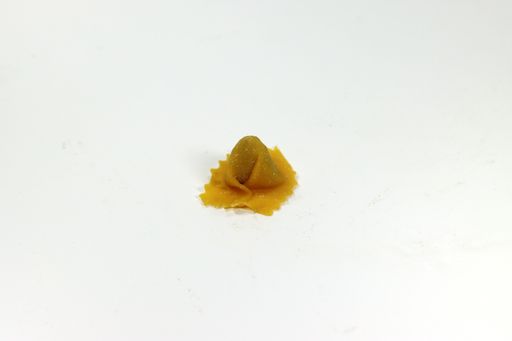 A closeup shot of freshly made tortellini pasta stuffed with meat isolated on a white background
