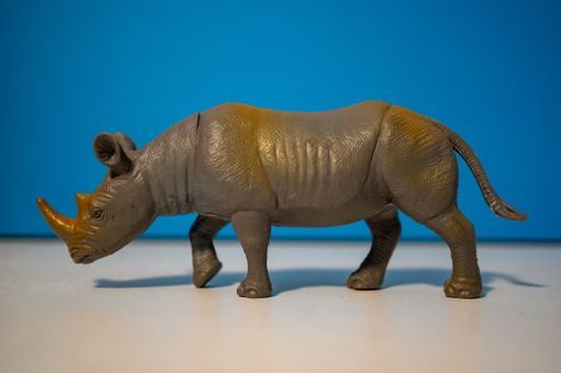 A closeup of a toy figurine of a rhino