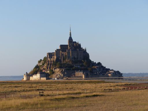 A stunning seascape featuring the island of Mont Saint-Michel located off the coast of France.