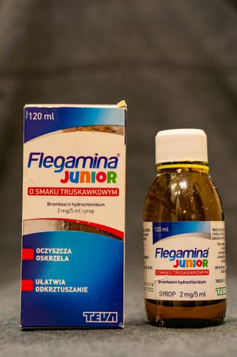 Polish Flegamina Junior coughing syrup with strawberry flavor in a box.