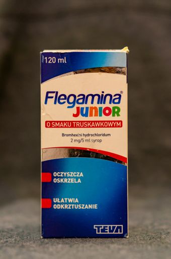 Polish Flegamina Junior coughing syrup with strawberry flavor in a box.