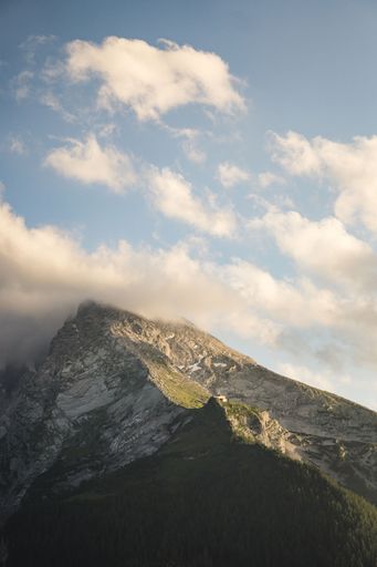 A vertical shot of the last golden light of the sun touching the Watzmann mountain in Berchtesgaden, Bavaria