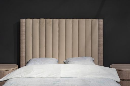 Bedroom, stylish made bed on a dark background. Getting ready to sleep.