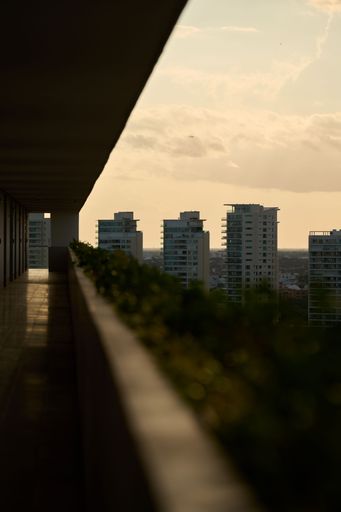 A vertical shot of Cancun city buildings taken from a balcony, Mexico