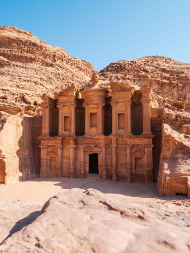 A vertical shot of an ancient archeological temple at historical Petra in Jordan