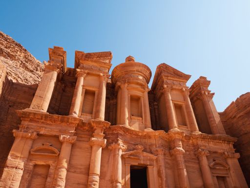 A low-angle shot of an ancient archeological temple at historical Petra in Jordan