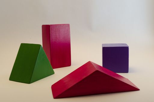 A closeup shot of colorful geometrical figures of wood for educational games