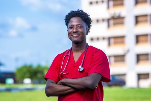 A young African-American doctor smiling with his hands crossed