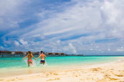 A romantic couple on enjoying their vacation at a tropical paradise island