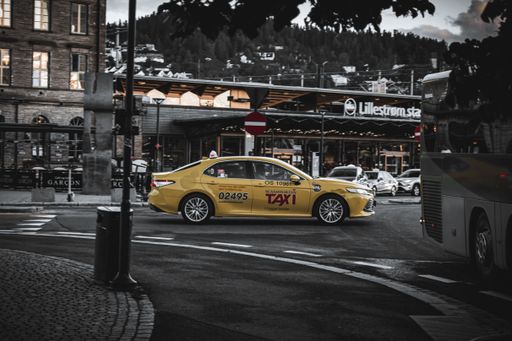 A yellow taxi cab in the street