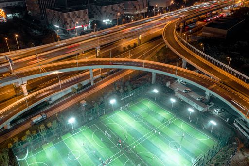 An Aerial view of the Lingjiashan Football Field surrounded by multiple bridges