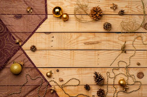 A top view of Christmas decorations on a wooden texture - perfect for background or wallpaper