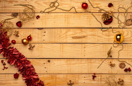 A top view of Christmas decorations on a wooden texture - perfect for background or wallpaper